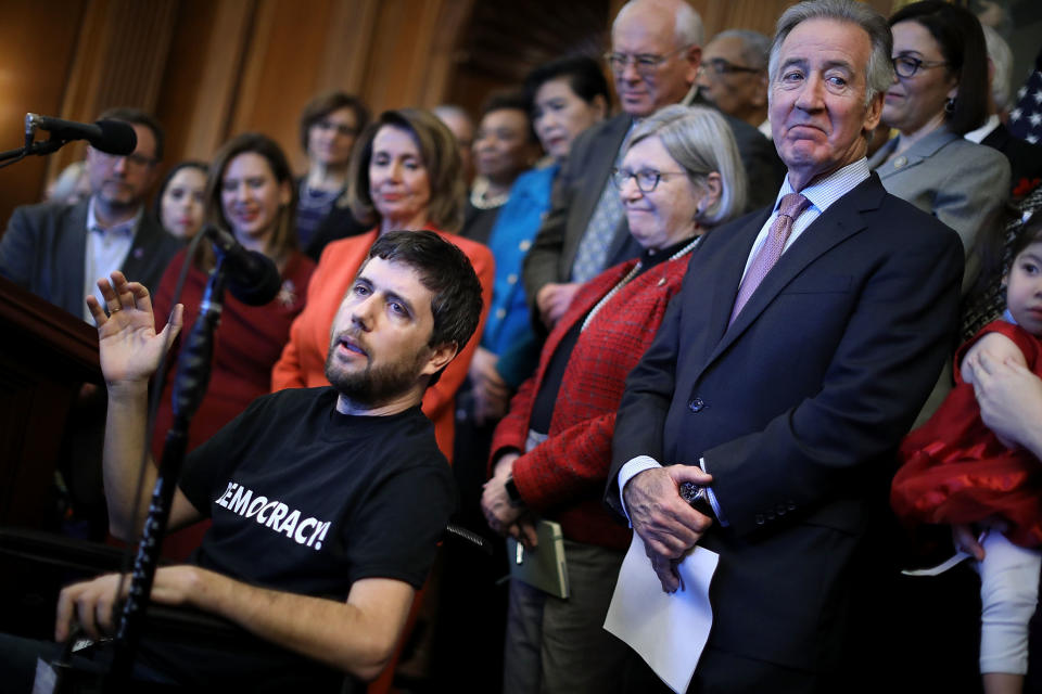 Ady Barkan speaks at a Dec. 19, 2017, press conference against the GOP tax bill organized by congressional Democratic leaders, including House Minority Leader Nancy Pelosi (D-Calif.) (Photo: Chip Somodevilla/Getty Images)