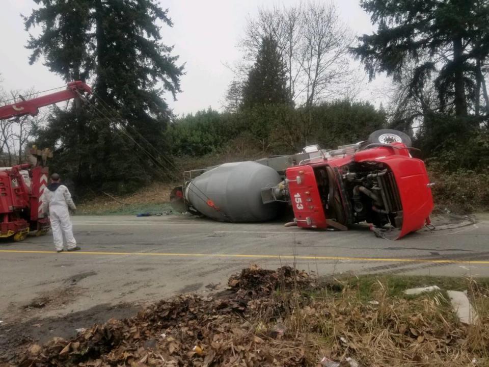 A cement mixer truck flipped onto its side on state Route 410 in Sumner on Thursday morning after it was struck in a four-vehicle collision, Washington State Patrol troopers said. 