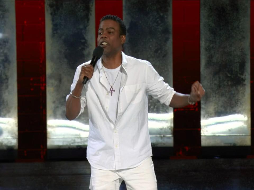 Chris Rock doing stand-up in front of a live audience in Baltimore.