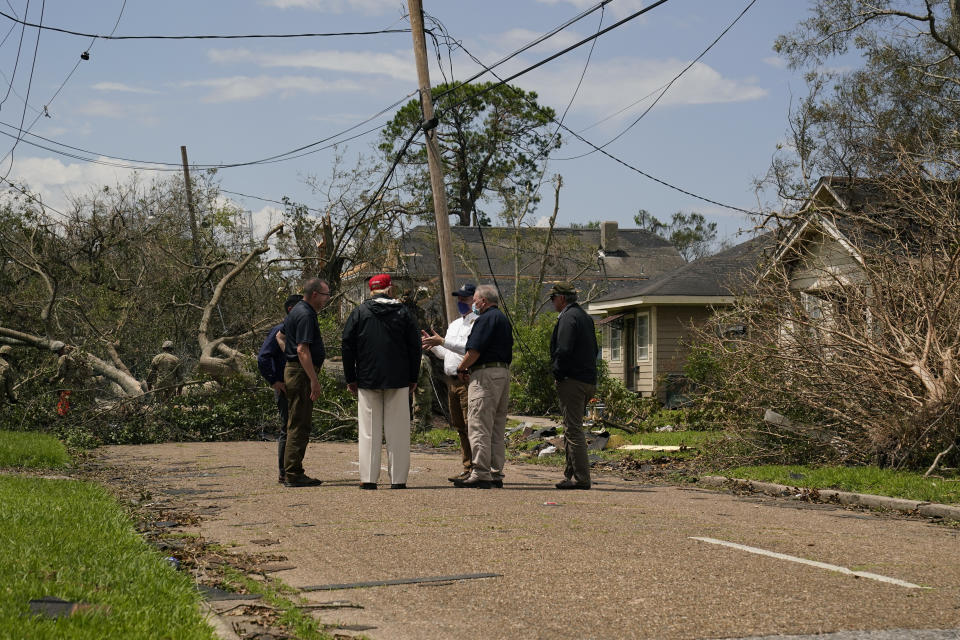 President Donald Trump tours damage from Hurricane Laura, Saturday, Aug. 29, 2020, in Lake Charles, La. (AP Photo/Alex Brandon)