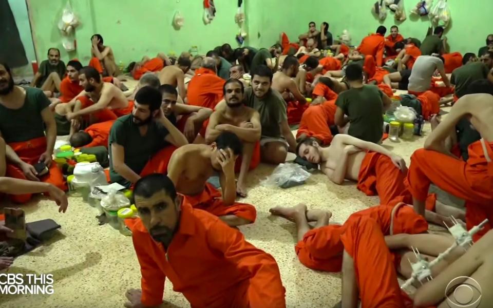 A prison in CBS News footage contains mostly prisoners detained after the final battle for Isil territory in Baghuz, eastern Syria - CBS