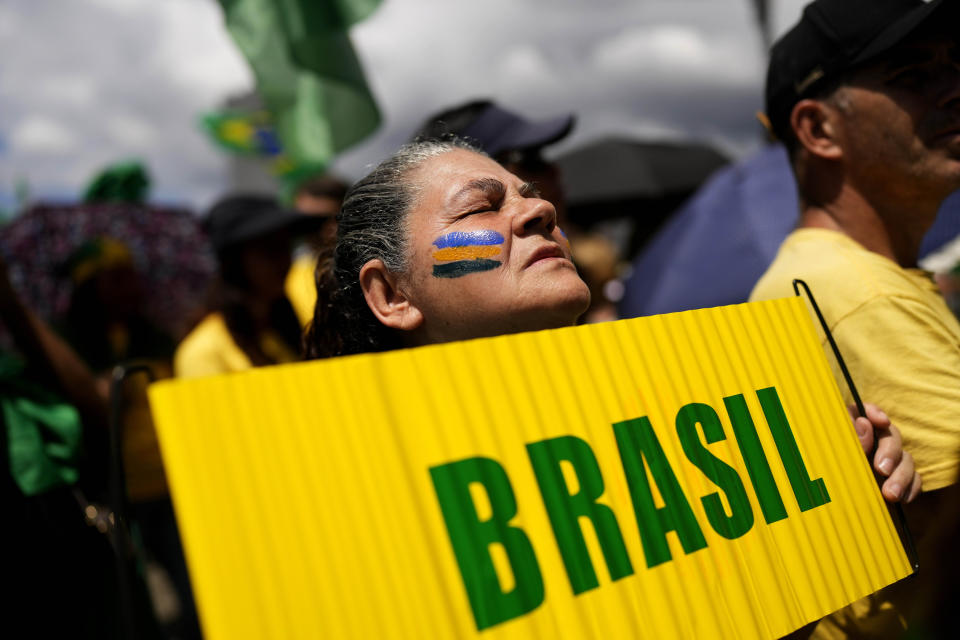 A supporter of President Jair Bolsonaro attends a protest against his defeat in the presidential runoff election, in Rio de Janeiro, Brazil, Sunday, Nov 6, 2022. Thousands of supporters called on the military Sunday to keep the far-right leader in power, even as his administration signaled a willingness to hand over the reins to his rival Luiz Inacio Lula da Silva. (AP Photo/Silvia Izquierdo)