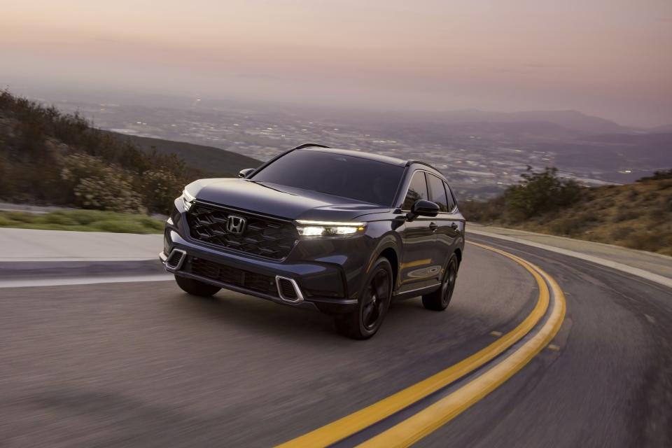This photo provided by Honda shows the 2024 Honda CR-V. The hybrid version of the CR-V comes well equipped with features and gets up to an estimated 40 mpg combined. (Courtesy of American Honda Motor Co. via AP)
