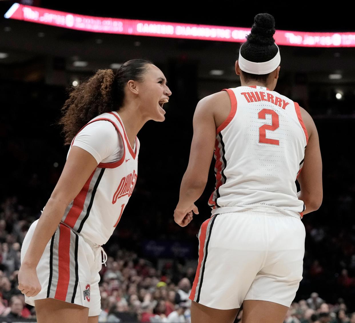 Jan. 14, 2024; Columbus, Ohio, USA; 
Ohio State Buckeyes guard Celeste Taylor (12) and Ohio State Buckeyes guard Taylor Thierry (2) celebrate after drawing a foul during the fourth quarter of an NCAA Division I basketball game against the Michigan State Spartans on Sunday at Value City Arena in Columbus.
