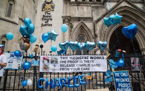 Supporters of Charlie Gard protest outside the High Court  - Credit: &nbsp;Paul Davey