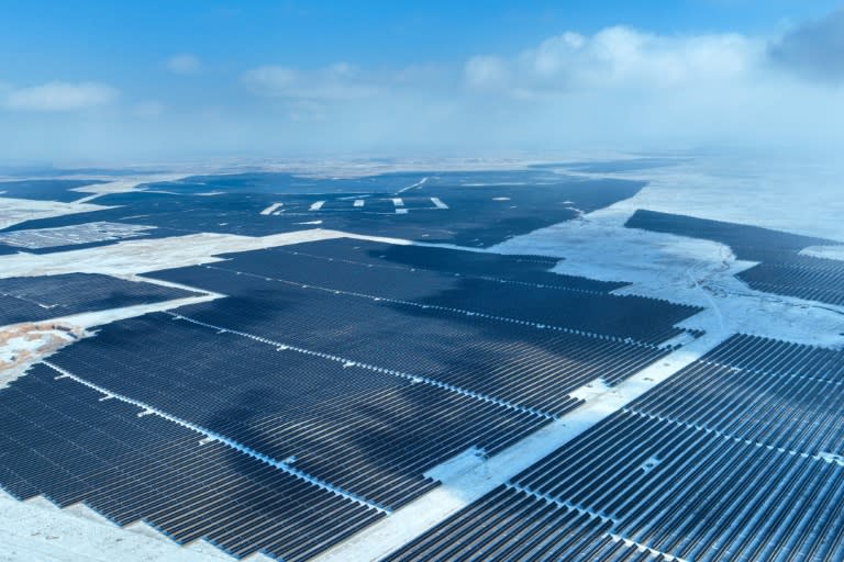 Solar panels in the Gobi desert in north China. China has twice as much wind and solar energy capacity under construction as the rest of the world combined (STR)