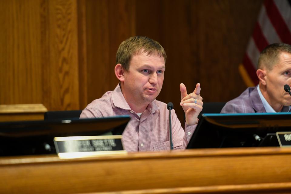 At-large city council member Rich Merkouris asks a question to the speaker during a meeting on Tuesday, May 21, 2024, at Carnegie Town Hall in Sioux Falls.