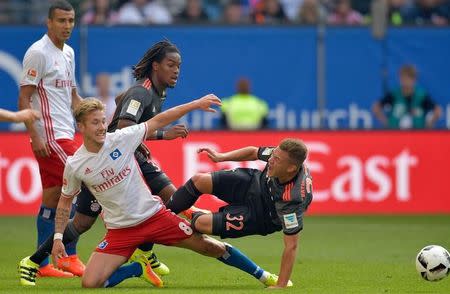 Football Soccer - HSV Hamburg v FC Bayern Munich - German Bundesliga - Volksparkstadion, Hamburg, Germany - 24/09/16 Hamburg's Lewis Holtby and Bayern Munich's Joshua Kimmich in action. REUTERS/Fabian Bimmer