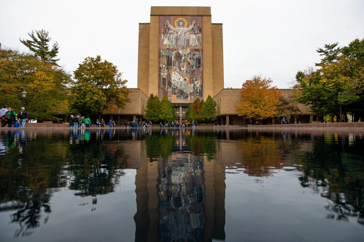 In this file photo, the "Touchdown Jesus" mural on the Hesburgh Library near some fall foliage is shown before the Notre Dame vs. North Carolina NCAA football game Saturday, Oct. 30, 2021, at Notre Dame Stadium in South Bend.