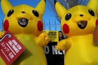 FILE PHOTO: Activists take part in a protest to demand Japan to stop supporting coal, outside the venue of the U.N. climate change conference (COP25) in Madrid