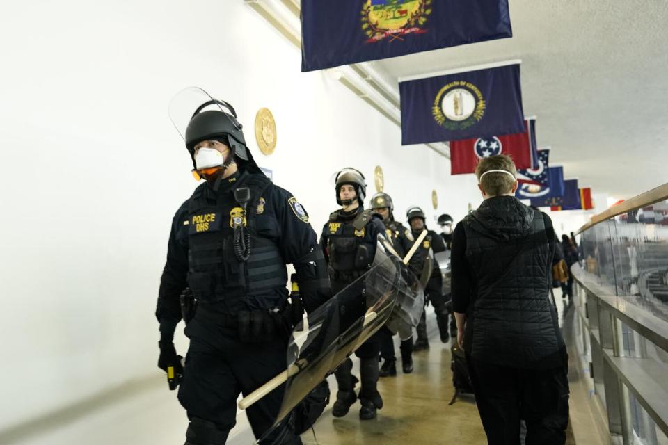 Police arrive at the Capitol to quite the protesters during the joint