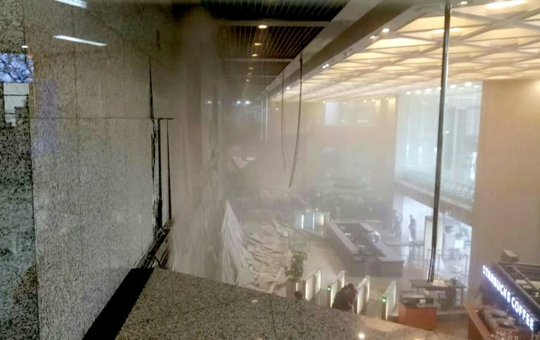 Dust clouded the lobby after a mezzanine floor collapsed at Indonesia's stock exchange in Jakarta