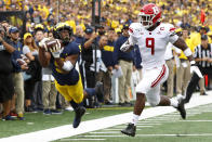 Michigan wide receiver Donovan Peoples-Jones (9) lies out to catch a pass as Rutgers linebacker Tyreek Maddox-Williams (9) defends in the second half of an NCAA college football game in Ann Arbor, Mich., Saturday, Sept. 28, 2019. The pass was incomplete when Peoples-Jones landed out of bounds. (AP Photo/Paul Sancya)