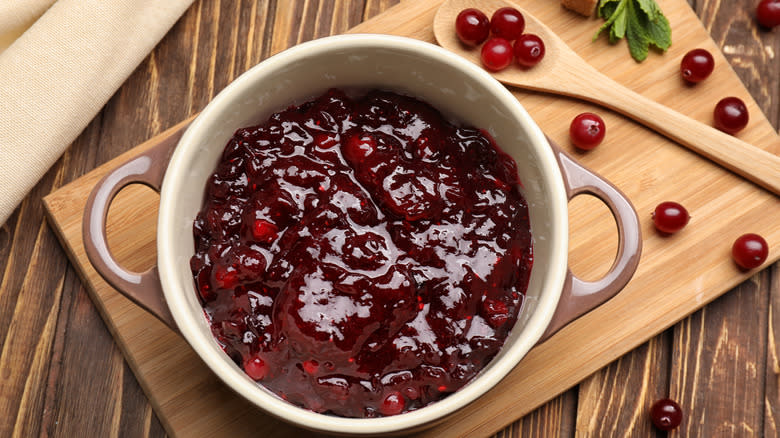 Cranberry sauce on wooden board