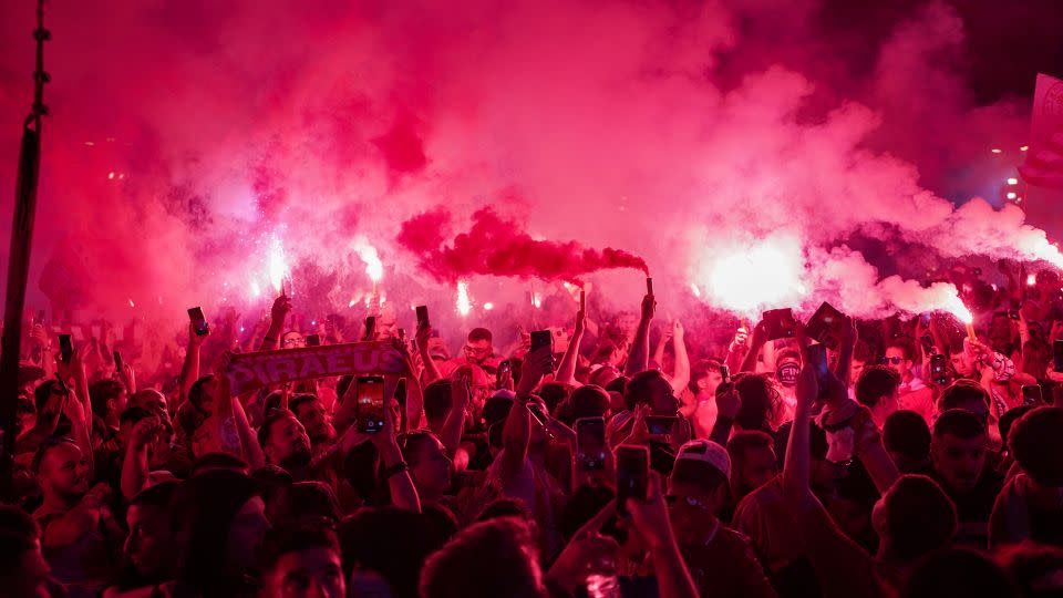 Olympiacos fans celebrate the teams win in Piraeus. - Giorgos Arapekos/NurPhoto/Getty Images