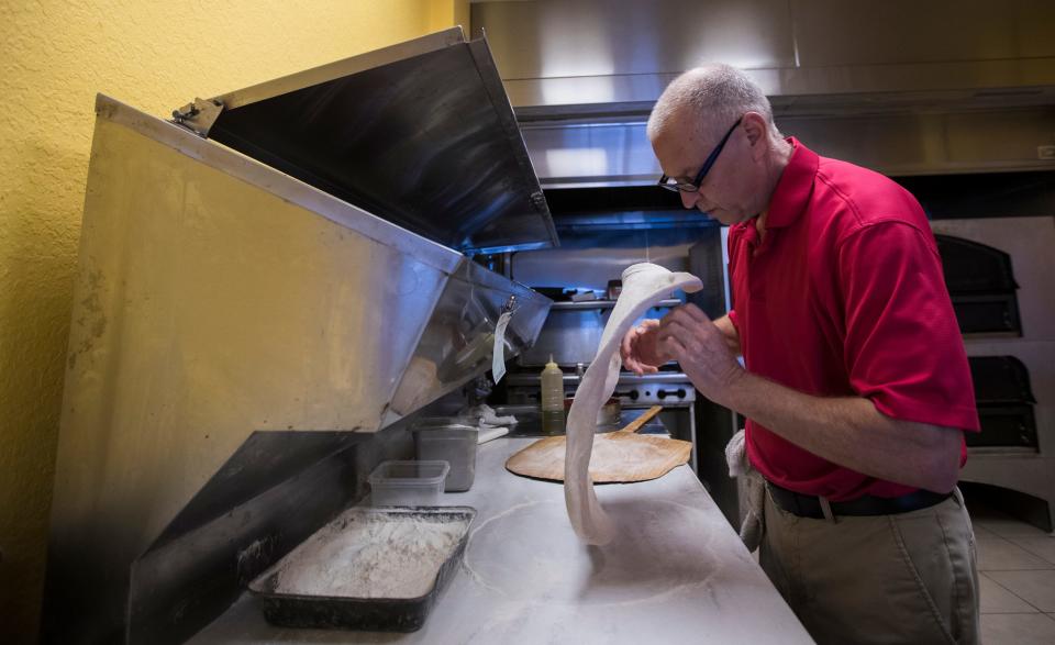 Joe Calderone, owner of Joe Daddy's Pizza in Cape Coral, readies a Neapolitan pizza pie for a customer, Friday afternoon, April 26, 2019.