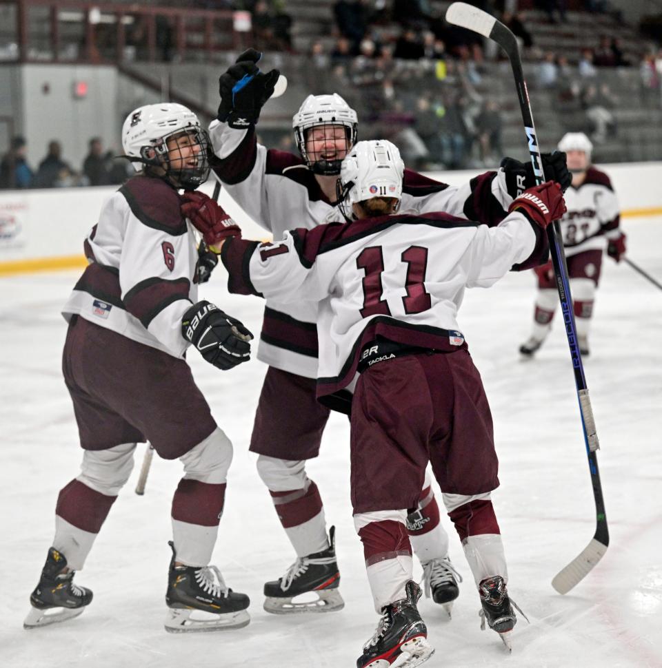 Casey Roth (11) celebrates with her Falmouth teammates after scoring the first of her team's goals against Sandwich in a 6-4 win.