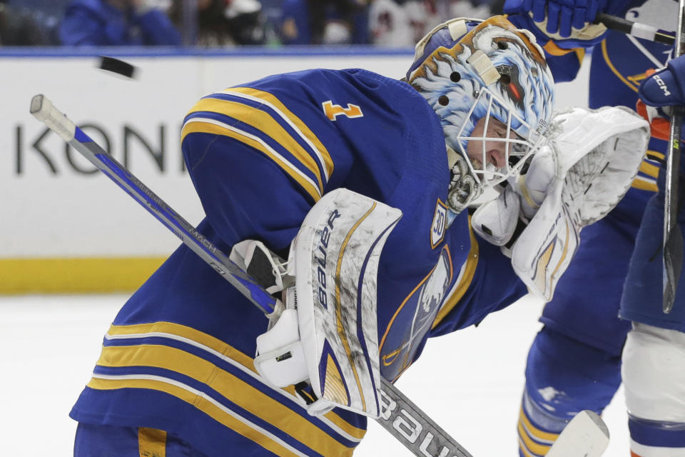 Buffalo Sabres goaltender Ukko-Pekka Luukkonen (1) reacts as the puck sails over his head during the second period of the team's NHL hockey game against the New York Islanders on Thursday, Jan. 19, 2023, in Buffalo, N.Y. (AP Photo/Joshua Bessex)