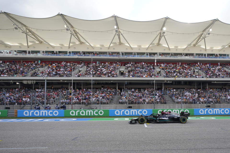 Mercedes driver Valtteri Bottas, of Finland, drives down the main straightaway during qualifications for the F1 U.S. Grand Prix auto race at Circuit of the Americas, Saturday, Oct. 23, 2021, in Austin, Texas. (AP Photo/Darron Cummings, Pool)