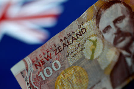 FILE PHOTO: A New Zealand Dollar note is seen in this picture illustration June 2, 2017. REUTERS/Thomas White/Illustration/File Photo