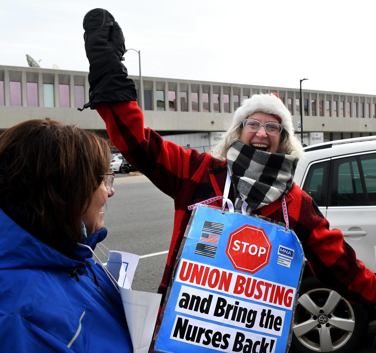 While walking the picket line Saturday morning, Karin Rack, RN, of Rutland expresses her joy over the tentative agreement reached between St. Vincent Hospital and the Massachsuetts Nurses Association.