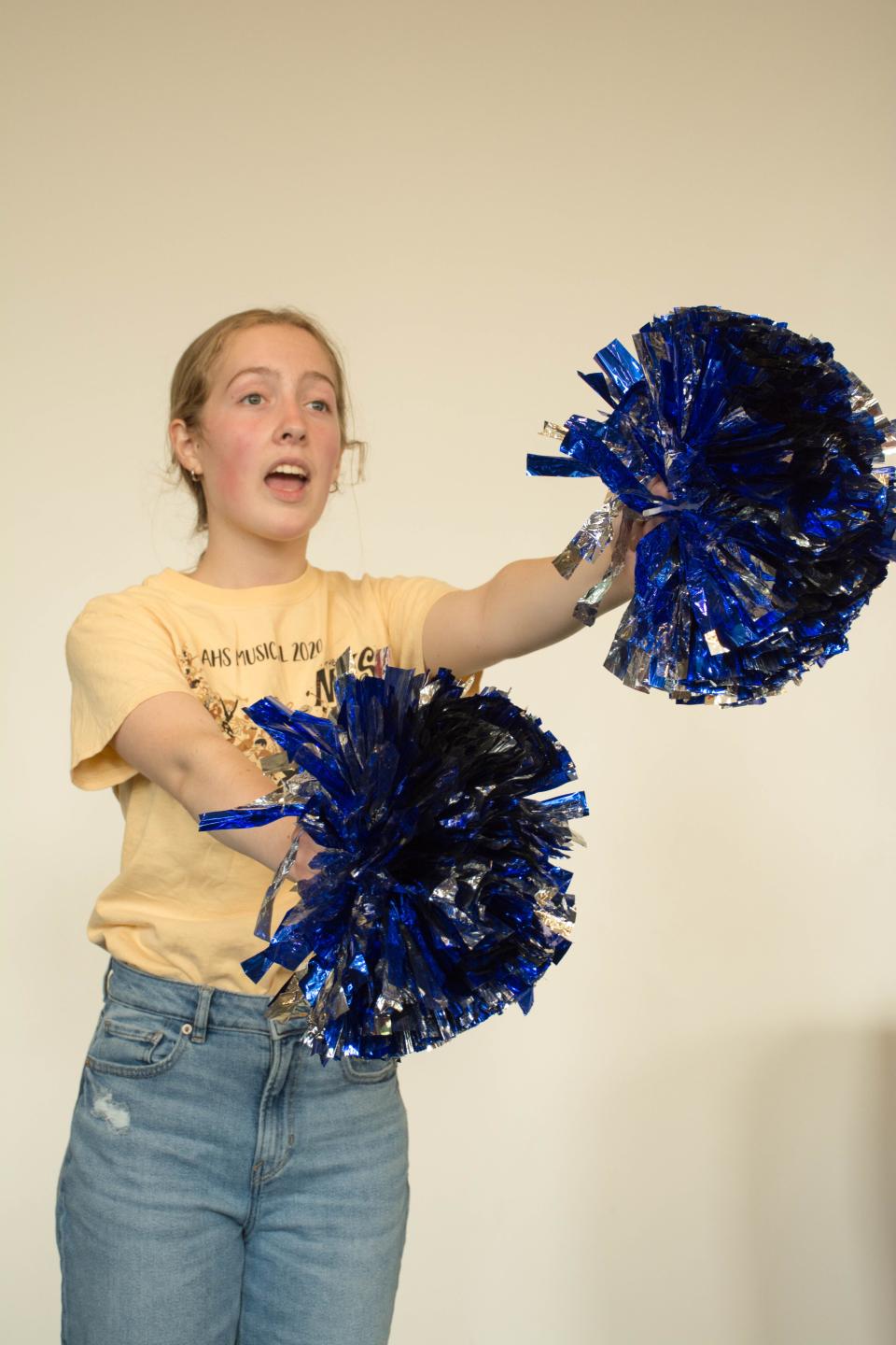 Mick, played by Julia Divine, leads a cheer for water in “Water Rocks!: The Musical.”