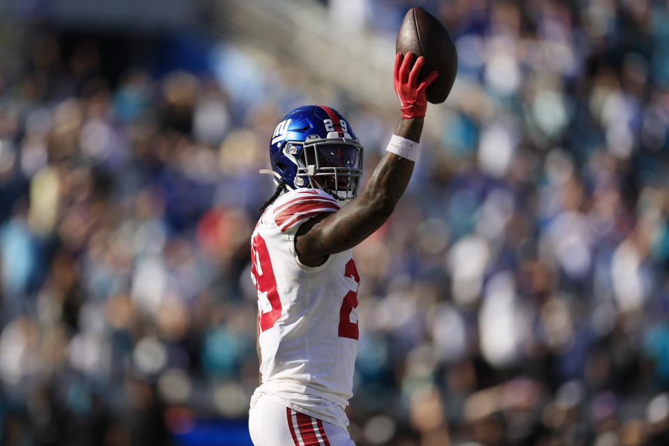New York Giants safety Xavier McKinney holds up at the ball after the team beat the Jacksonville Jaguars on Oct. 23.