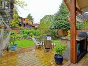 <p><span>2804 Cook St., Victoria, B.C.</span><br> Outside you’ll find a well-cared-for garden, with fruit trees, a sunny patio and a pond.<br> (Photo: Zoocasa) </p>