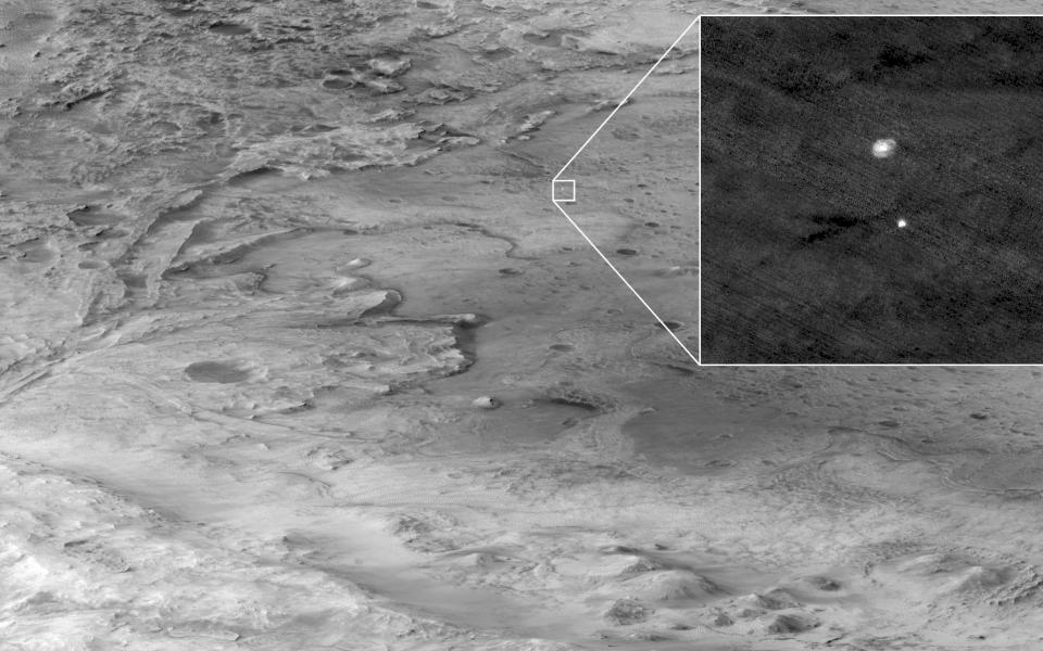 The Mars Reconnaissance Orbiter captured a photograph of the rover descending via parachute - REUTERS