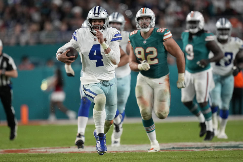 Dallas Cowboys quarterback Dak Prescott (4) runs for a first down during the second half of an NFL football game, Sunday, Dec. 24, 2023, in Miami Gardens, Fla. (AP Photo/Rebecca Blackwell)