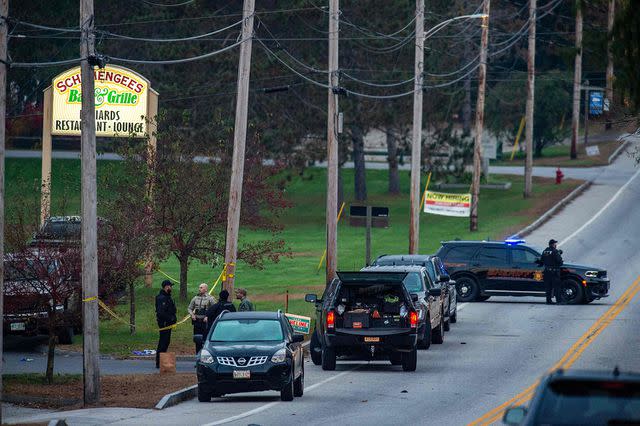 <p>JOSEPH PREZIOSO/AFP via Getty Images</p> Police presence at Schemengees Bar where a mass shooting occurred in Lewiston, Maine on October 26, 2023