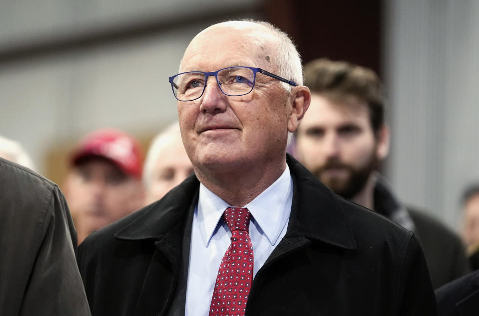 FILE - Michigan Republican Party chair Pete Hoekstra listens at a campaign rally in Waterford Township, Mich., Feb. 17, 2024. The Michigan GOP, long a bastion of traditional conservatism, is in a cash crunch and power struggle within its ranks. Some are openly alienating lifetime Republicans and undermining the party's work in key swing states. Allies of Hoekstra, Trump's chosen state chairman, are in court trying to force out Kristina Karamo, who was elected last year. (AP Photo/Paul Sancya, File)