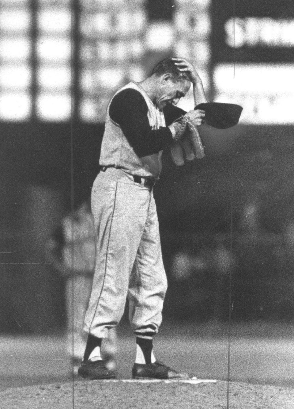 Harvey Haddix of the Pittsburgh Pirates wipes his brow flirting with baseball history as he pitches 12 perfect innings against the Milwaukee Braves May 27, 1959. He lost the game 1-0 in the 13th inning.