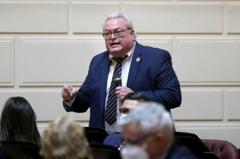 Rep. William O'Brien makes a point during debate on the Insurance Unfair Claims Settlement Act.