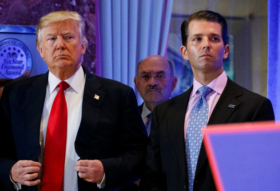 In this Jan. 11, 2017, shows President-elect Donald Trump, left, his chief financial officer Allen Weisselberg, center, and his son Donald Trump Jr., right, attend a news conference in the lobby of Trump Tower in New York. Weisselberg has been indicted in New York.