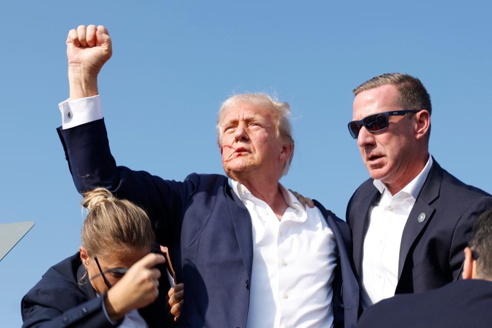 Republican presidential candidate former President Donald Trump is rushed offstage during a rally on July 13, 2024 in Butler, Pennsylvania.