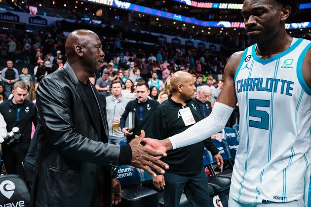 Charlotte Hornets owner Michael Jordan shakes hands with Mark Williams of the Charlotte Hornets after their game against the Orlando Magic at Spectrum Center on March 3, 2023, in Charlotte, North Carolina. Jordan selling off the Hornets — which we can reasonably assume the fans are justifiably thrilled about — places the spotlight on an uncomfortable truth for the NBA. 