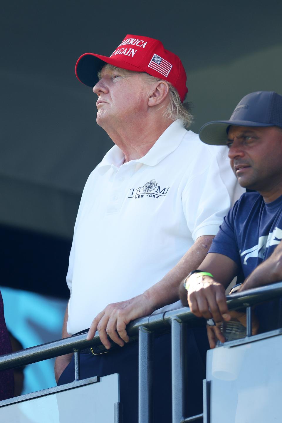 Trump looking on at the 18th green during day three of the LIV Golf Invitational series tournament on August 13.