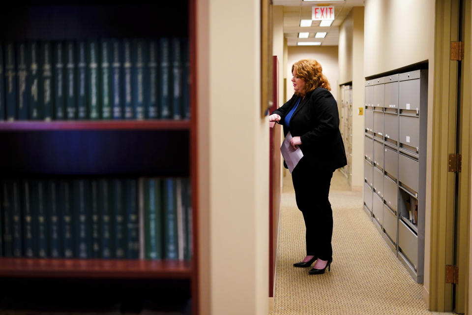 Attorney Robin Frank speaks with a paralegal at their office in Pittsburgh, Thursday, March 17, 2022. Frank, a family law attorney in Pittsburgh, is still trying to untangle how, exactly, Allegheny County’s algorithm is impacting each client she shepherds through the system. "There's no way to prove it – that's the problem," Frank says. (AP Photo/Matt Rourke)