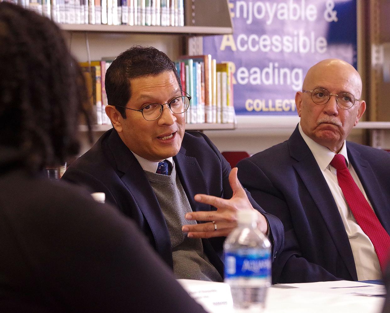 Commissioner of the state's Department of Higher Education Noe Ortega, left, responds to comments made by Massasoit Community College student Ailee Martin, left, at a roundtable at the college on Thursday, March 9, 2023, where Ortega and Massachusetts Secretary of Education Patrick Tutwiler discussed Gov. Maura Healey's proposed MassReconnect program that would cover the entire cost of community college for all Massachusetts residents over 25 years old. To the right is Massasoit President Ray DiPasquale.