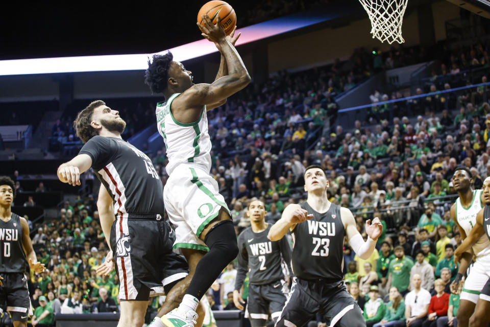 Oregon guard Jermaine Couisnard (5) shoots against Washington State during the first half of an NCAA college basketball game in Eugene, Ore., Saturday, Feb. 10, 2024. (AP Photo/Thomas Boyd)