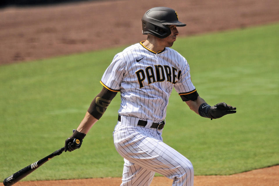 San Diego Padres' Jason Castro hits an RBI double to right off Los Angeles Dodgers starting pitcher Brusdar Graterol in the second inning of a baseball game Wednesday, Sept. 16, 2020, in San Diego. (AP Photo/Derrick Tuskan)