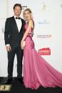 <p>Alex Nation donned this stunning purple gown from Georgia Young Couture for the red carpet as she posed alongside her dapper beau Richie Strahan.</p>