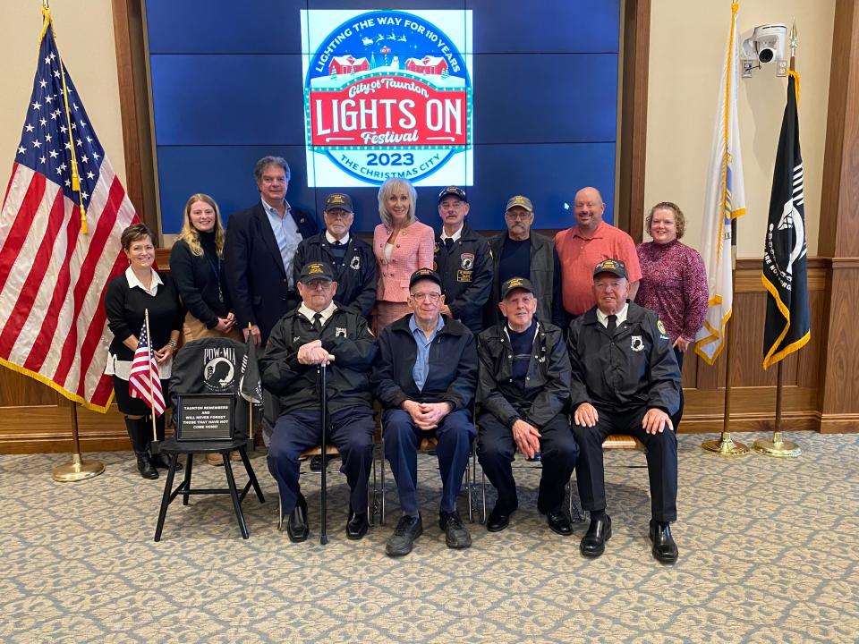 Members of the Taunton Area Vietnam Veterans Association and the Christmas Parade Committee. From left to right: Top: Sue Barber, Ally Webster, George Mendros, Dennis Proulx, Mayor Shaunna O'Connell, Chip Metzger, Armand L'Heureux, AJ Marshall, and Renee Menard. Bottom: Mike House, Larry Violette, Ed Kelly, and Arthur DePonte. Photo taken November 14, 2023.