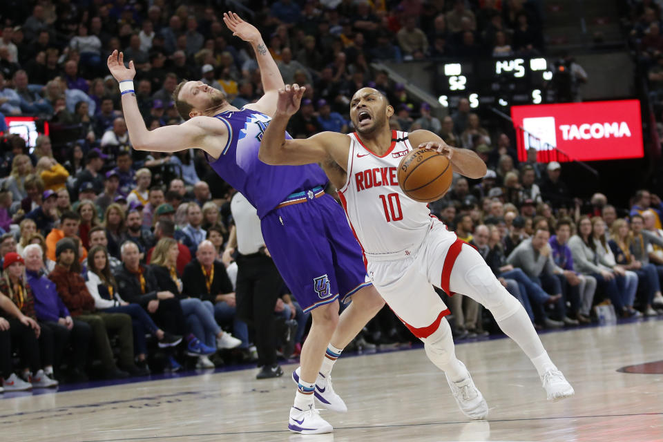 Houston Rockets guard Eric Gordon (10) drives around Utah Jazz guard Joe Ingles, left, in the first half during an NBA basketball game Monday, Jan. 27, 2020, in Salt Lake City. (AP Photo/Rick Bowmer)