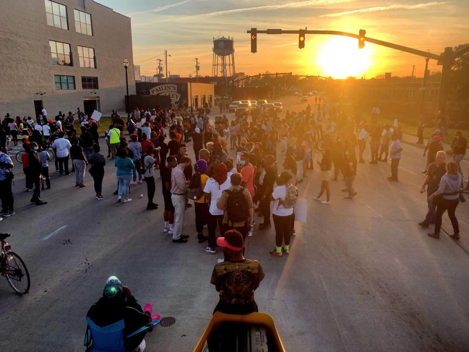 Protesters block the US Highway 158 bridge over Pasquotank River in Elizabeth City, N.C. Tuesday evening in advance of an 8pm curfew ordered by the city. Protests continued Tuesday following the shooting death of Andrew Brown Jr. last week by Pasquotank County sheriff’s deputies.