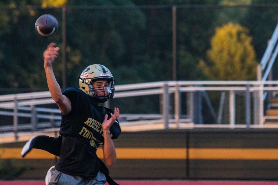Mason Cuccia passes the ball to a teammate during football practice at FDR High School in Staatsburg, NY on  August 24, 2022.