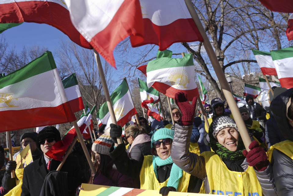 <p>Demonstrators hold Iranian flags during a rally in Lafayette Park across from the White House in Washington, on Saturday, Jan. 6, 2018, in solidarity with anti-government demonstrators in Iran. Iran has seen its largest anti-government protests since the disputed presidential election in 2009. (Photo: Pablo Martinez Monsivais/AP) </p>