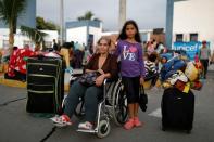 The Wider Image: Venezuelan mothers, children in tow, rush to migrate