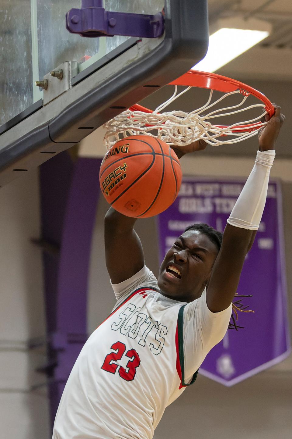 Highland Park forward Jacorey Robinson (23) dunks the ball during Sub-State March. 1, 2024 at Topeka West High School.